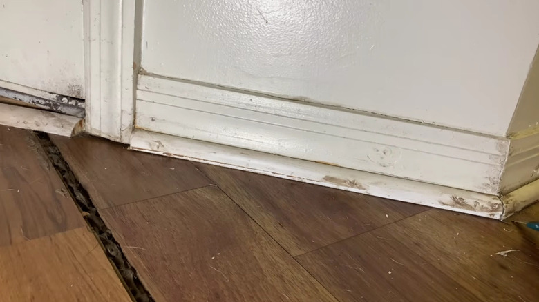 Worn baseboards and scuffed trim that make a clean space feel neglected