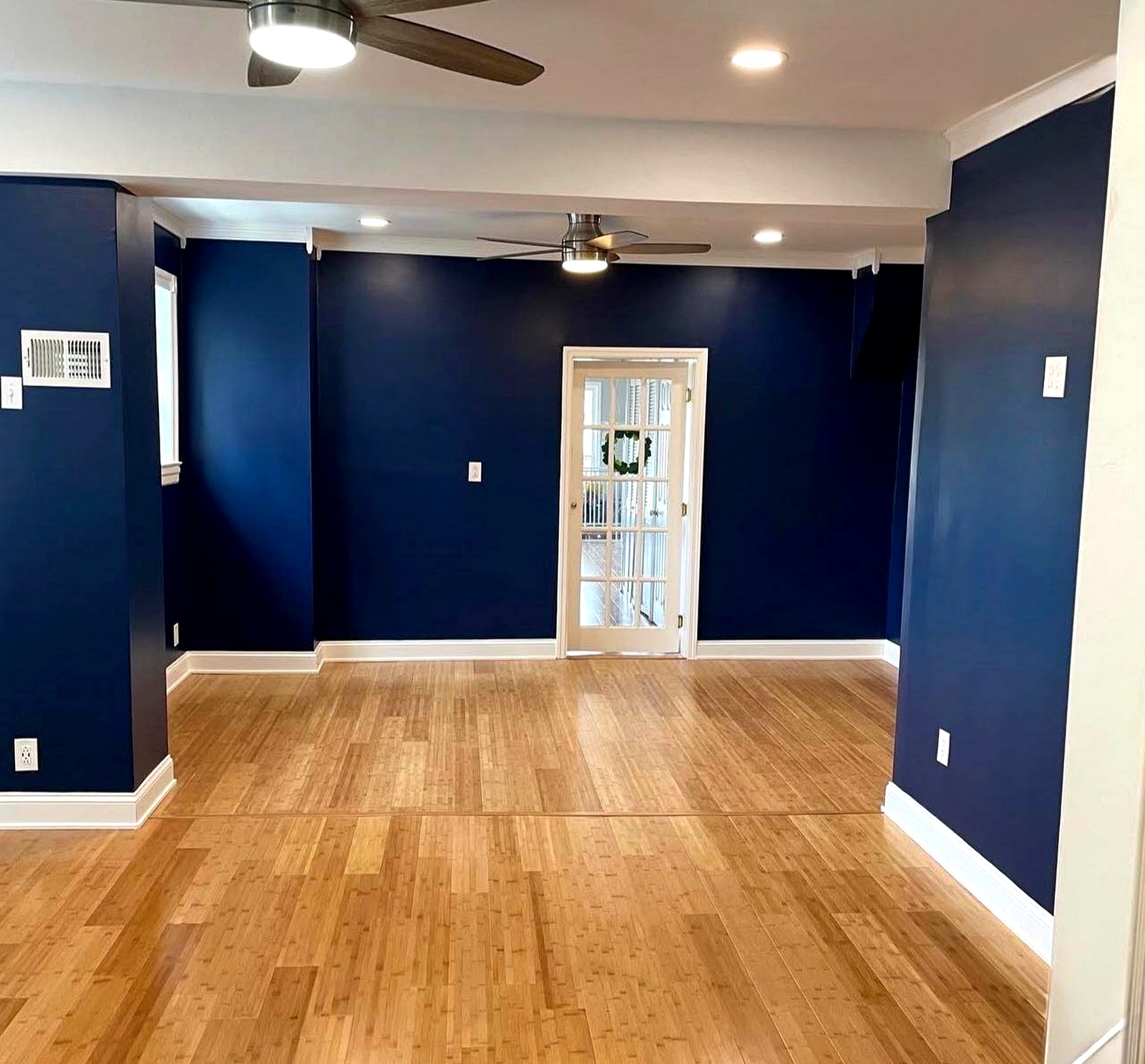 Clearview finished project — navy accent wall, new flooring, crown molding
